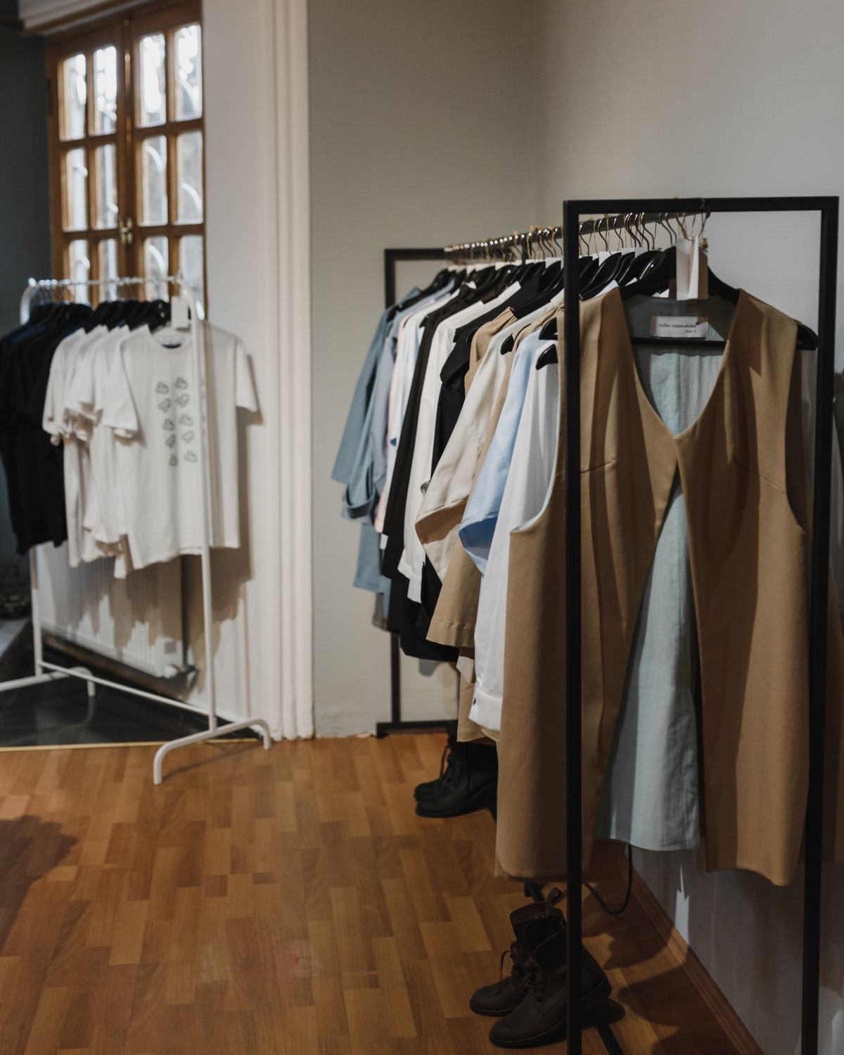 Curated neutral fashion collection displayed in a boutique